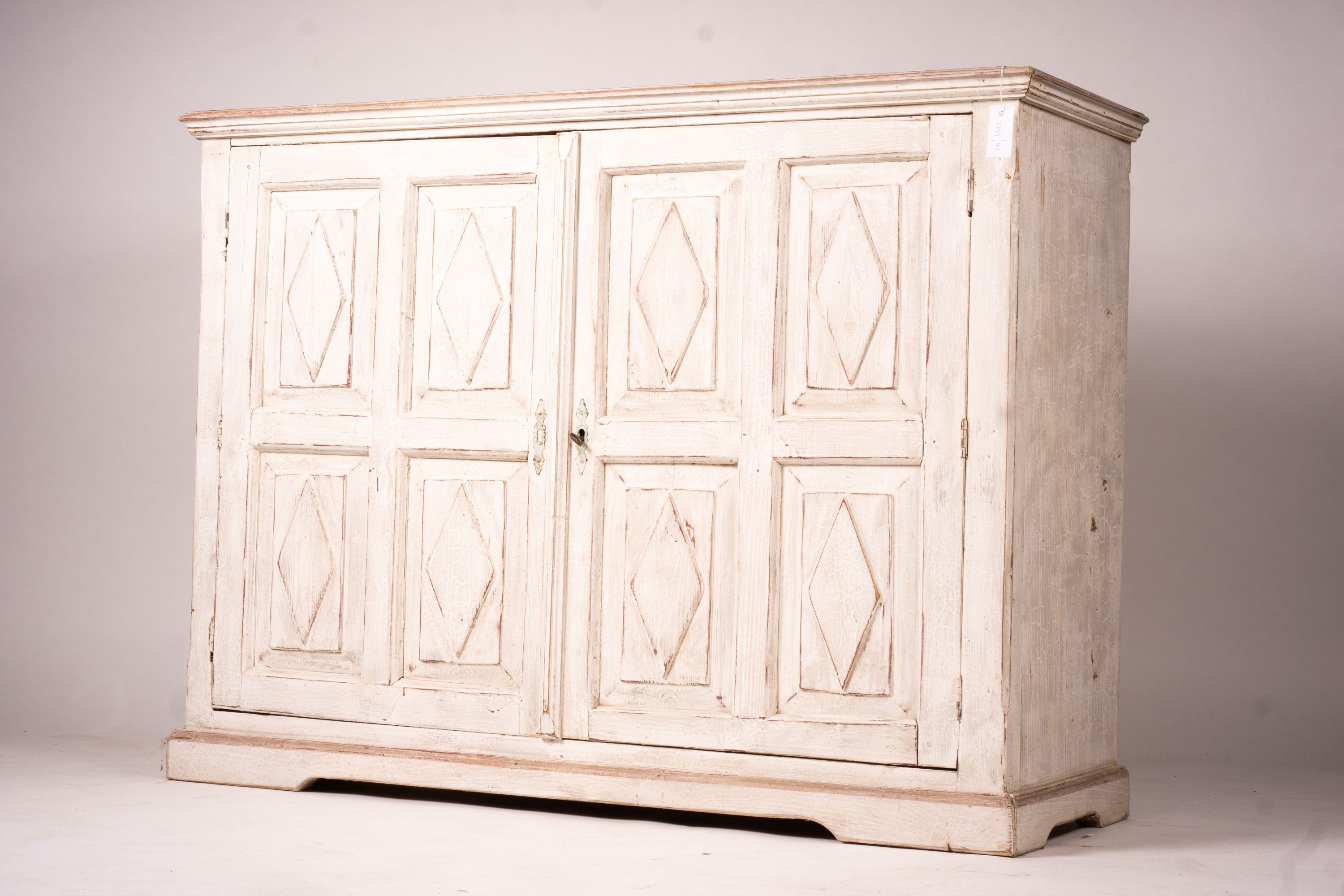 A 19th century Continental painted pine two door side cabinet, width 142cm, depth 50cm, height 106cm